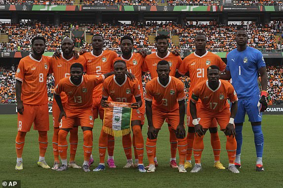 Ivory Coast squad pose before the African Cup of Nations Group A soccer match between Ivory Coast v Nigeria at the Olympic Stadium of Ebimpe, Abidjan, Ivory Coast, Thursday, Jan. 18, 2024. (AP Photo/Sunday Alamba)