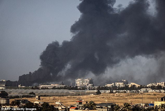 A picture taken from Rafah shows smoke billowing over Khan Yunis in the southern Gaza Strip during Israeli bombardment on January 22