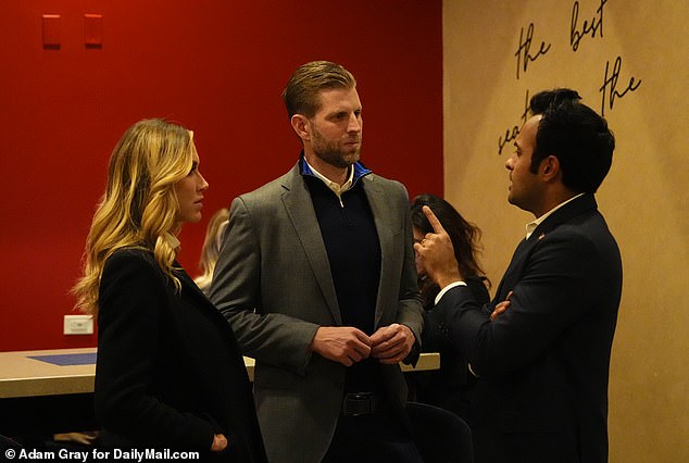 Eric Trump and Lara Trump talk with Vivek Ramaswamy as they wait for New Hampshire results