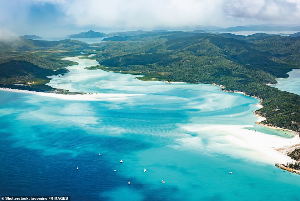 WHITEHAVEN BEACH, WHITSUNDAYS, QUEENSLAND, AUSTRALIA: This is 'one of Australia's most photogenic natural icons', says the book, adding: 'When you sink your toes into the 98 per cent pure silica sands of this dazzling beach you’ll understand the hype'