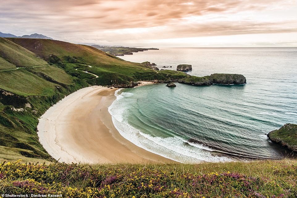 PLAYA DE TORIMBIA, LLANES, ASTURIAS, SPAIN: 'This is serene Torimbia,' the book says, 'one of Asturias’ most-loved beaches and one of Spain’s original naturist spots since the 1960s, thanks to its secluded natural setting'
