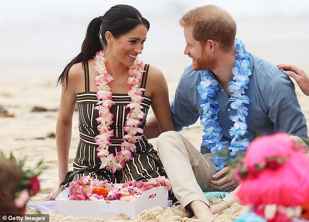 Meanwhile it's also a marked contrast from Meghan's previous island looks, such as her soft floral ensembles during a 2018 trip across Australia, Fiji, Tonga and New Zealand. Pictured on Bondi Beach
