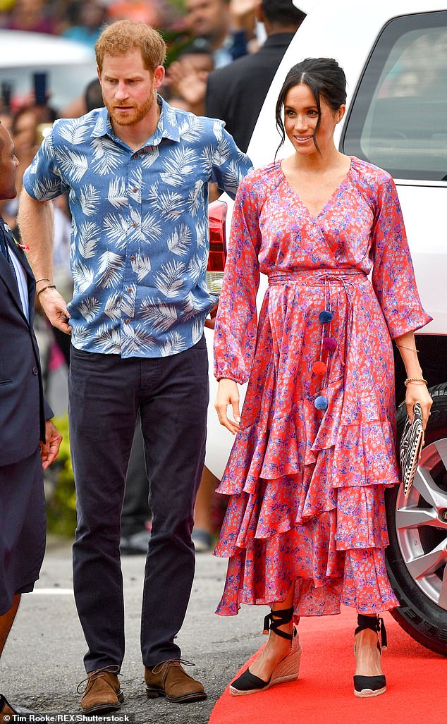 Meghan's previous island looks featured softer floral ensembles. Pictured in Fiji with Prince Harry in 2018