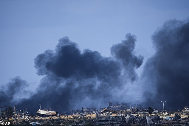 Fears of an escalation in the Middle East come as fighting continues to rage in Gaza between Israeli forces and the Iran-backed Hamas terror group. Pictured: Smoke rises following an Israeli bombardment in the Gaza Strip, as seen from southern Israel, January 30