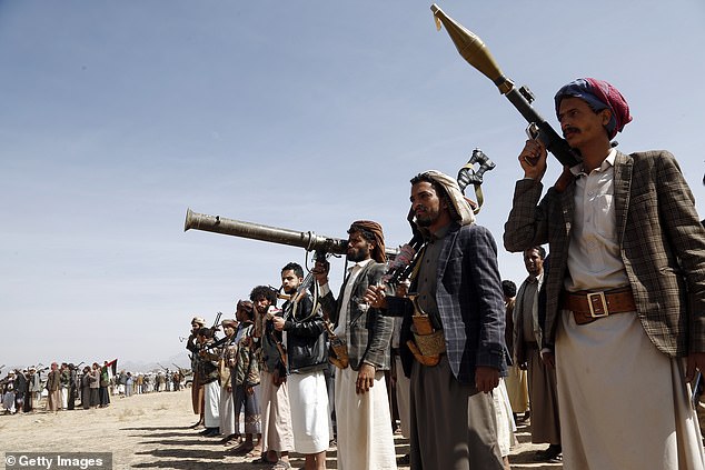 Iran-backed proxies have been causing chaos in the region, and have dramatically stepped up their attacks since Israel began attacking Gaza in response to the October 7 terror attack carried out by Hamas, also an Iran-backed group. Pictured: Houthi rebel fighters are seen in Yemen, from where the group has attacked shipping vessels in the Red Sea