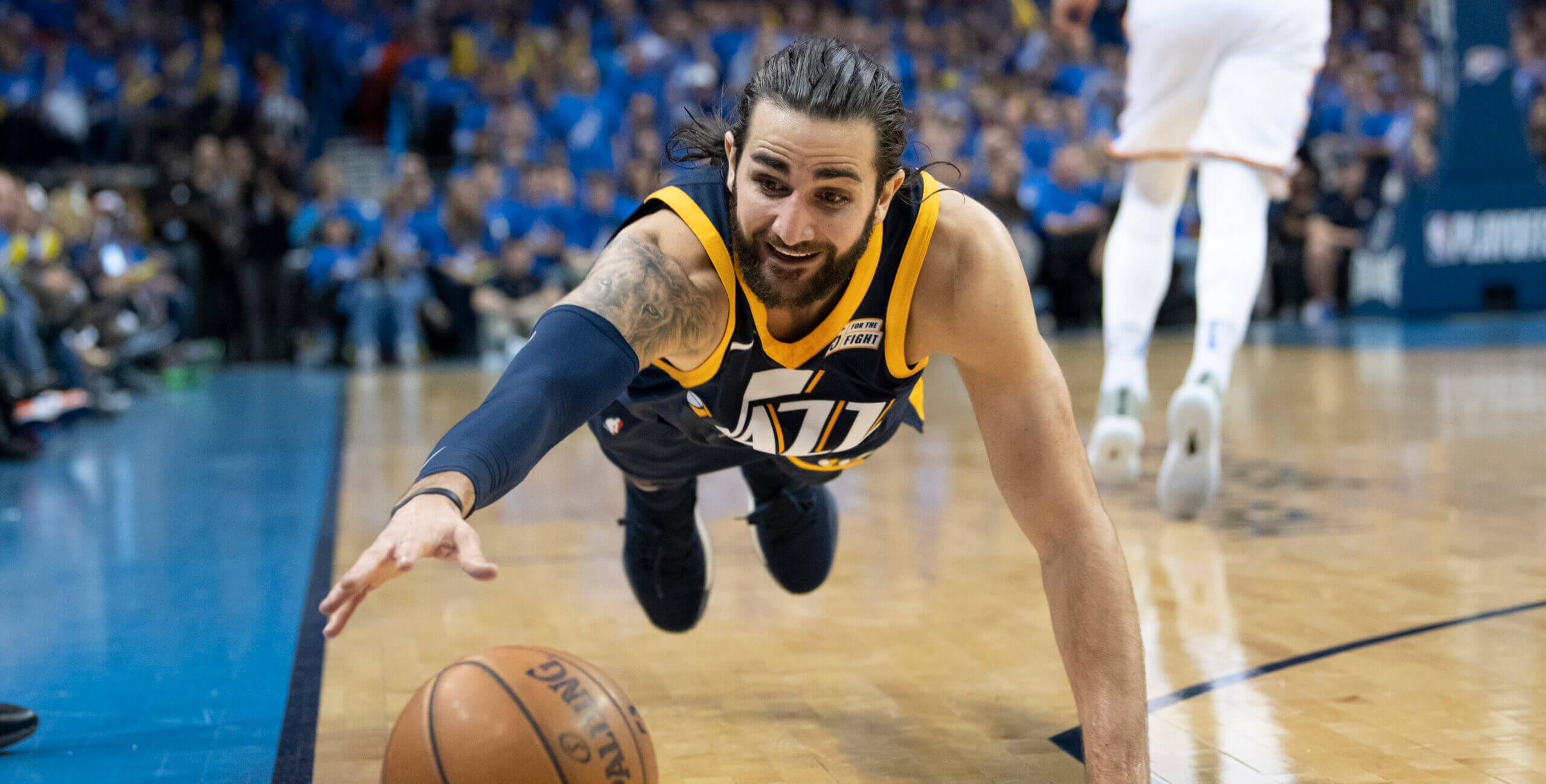 Ricky Rubio diving to save a ball from going out of bounds