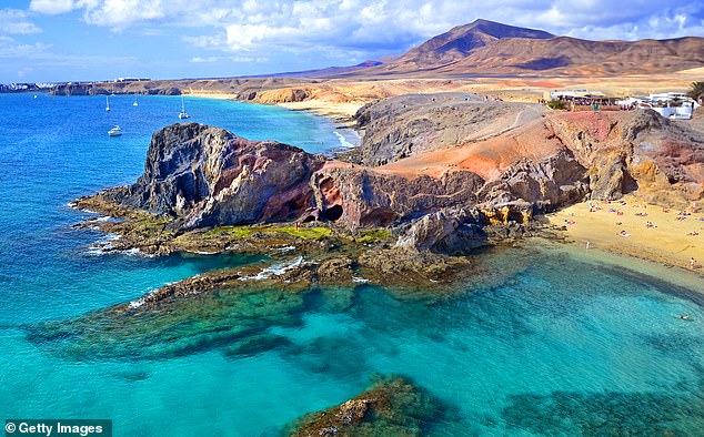 In February, Lanzarote's President María Dolores Corujo said she wanted to see the island rely less heavily on 'the British market', and focus on tourists from mainland Europe. Pictured, a beach in Lanzarote