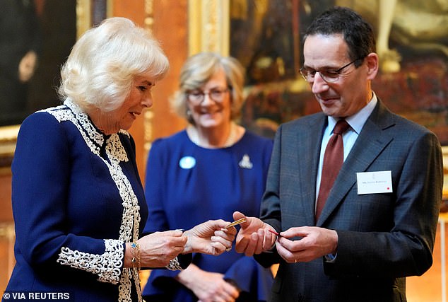 Mr Bartley, who is head of the Royal Bindert, showed the Queen some miniature books