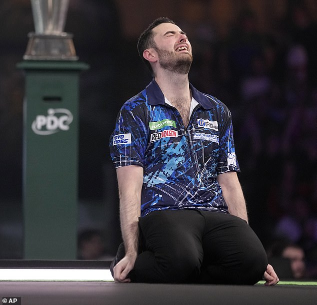 Luke Humphries sinks to his knees and weeps as he wins the World Darts Championship final