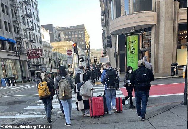 One snap, taken in the heart of the city's famed shopping district , shows a group of tourists wandering down a gutted Powell St - a way once bustling with businesses.