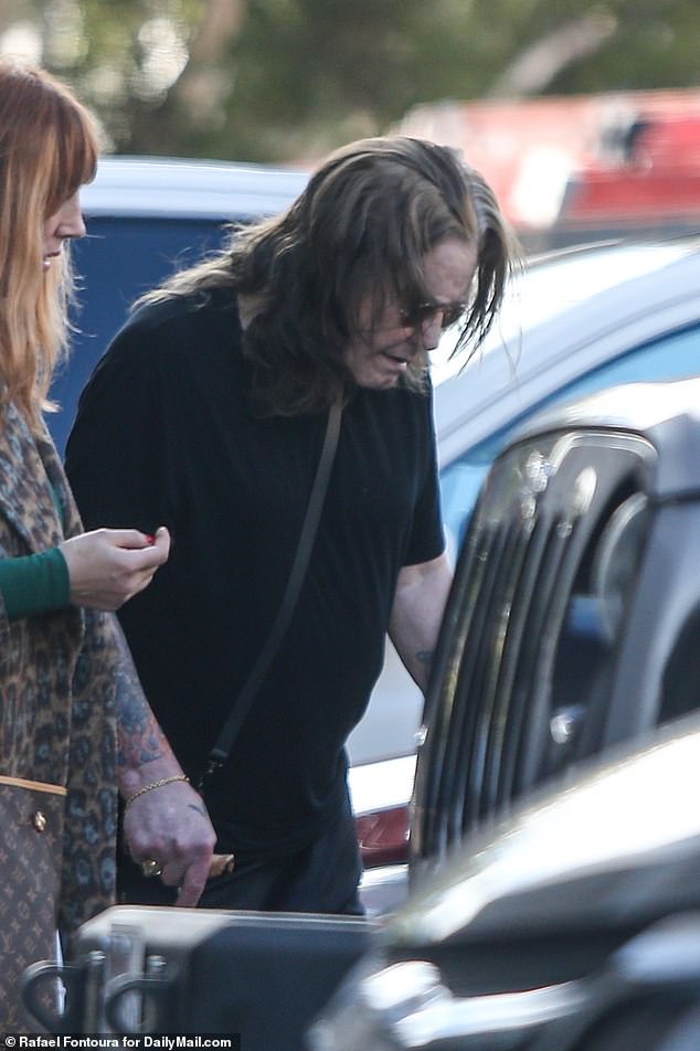 DailyMail.com snapped photos of the legendary Black Sabbath frontman as he left the building while carrying a cane to help steady himself