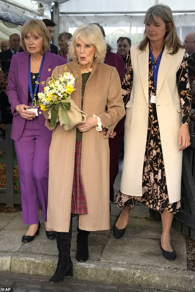 Today, Queen Camilla described the King as doing 'fine' while chatting to a member of the public during a visit to Deacon and Sons, a 175-year-old family run jewellery shop in Swindon