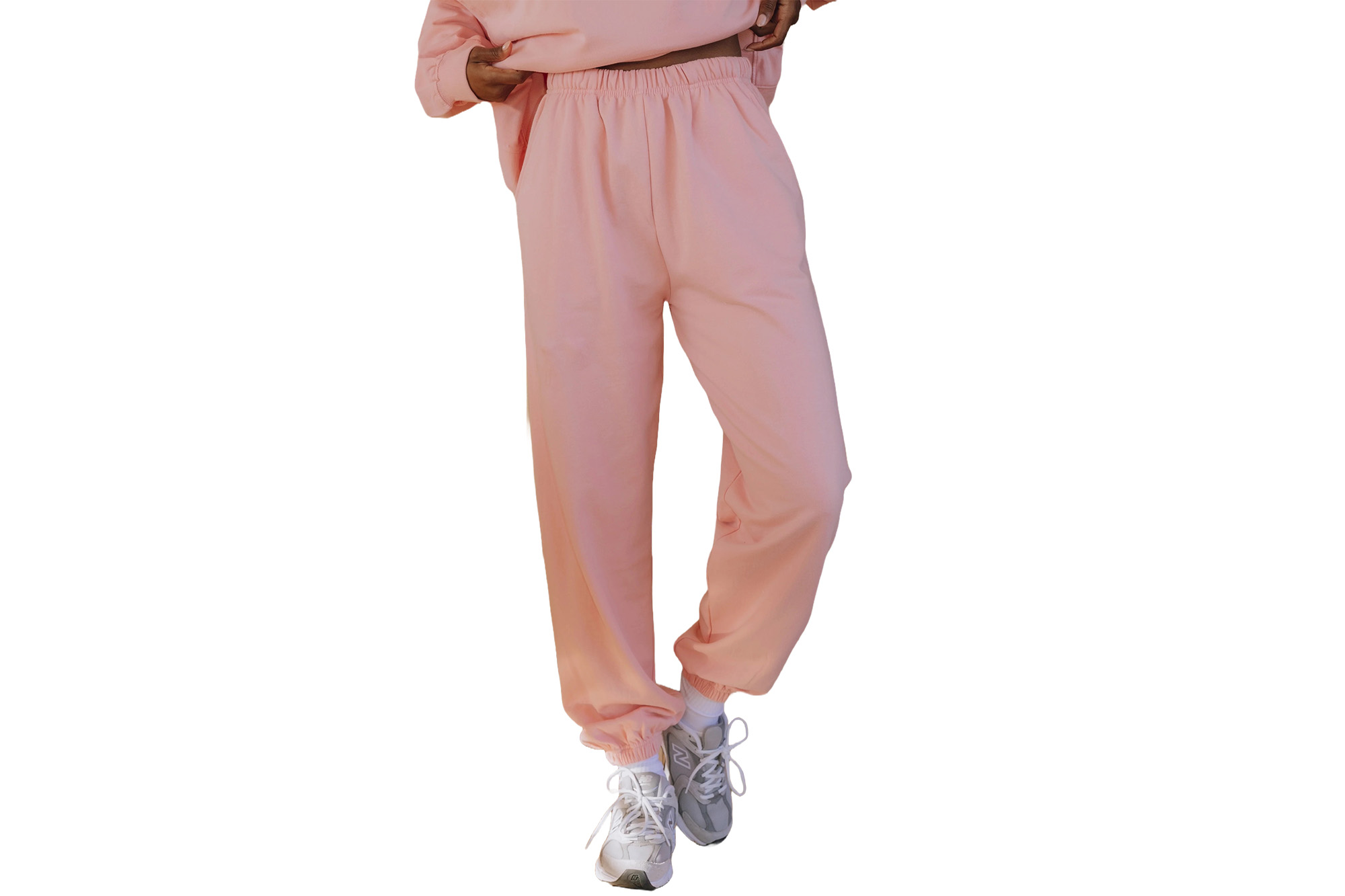 A model in pink fleece joggers
