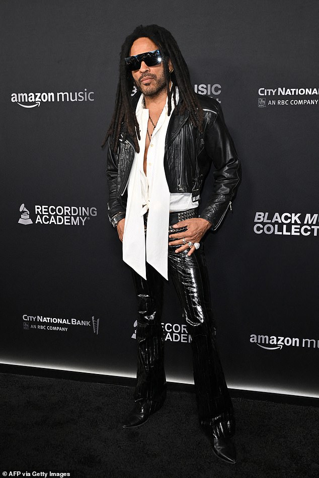 Lenny Kravitz, 59, was every inch the cool rockstar in a black leather jacket, matching pants, and a white shirt he left partially unbuttoned
