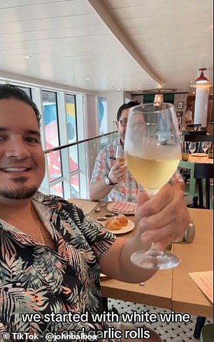 In the clip, he explains: 'We were one of the first to dine onboard Icon of the Seas at Giovanni's Italian Kitchen. We started with white wine'
