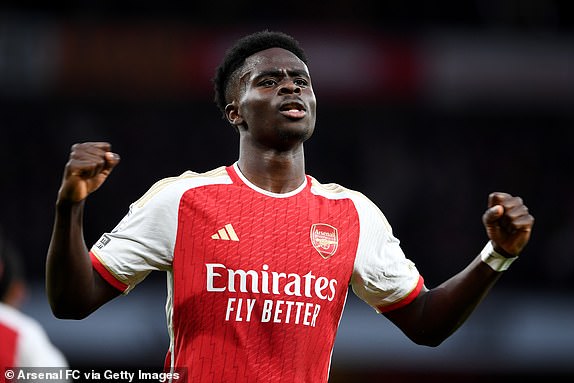 LONDON, ENGLAND - FEBRUARY 04: Bukayo Saka of Arsenal celebrates scoring his team's first goal during the Premier League match between Arsenal FC and Liverpool FC at Emirates Stadium on February 04, 2024 in London, England. (Photo by Stuart MacFarlane/Arsenal FC via Getty Images)