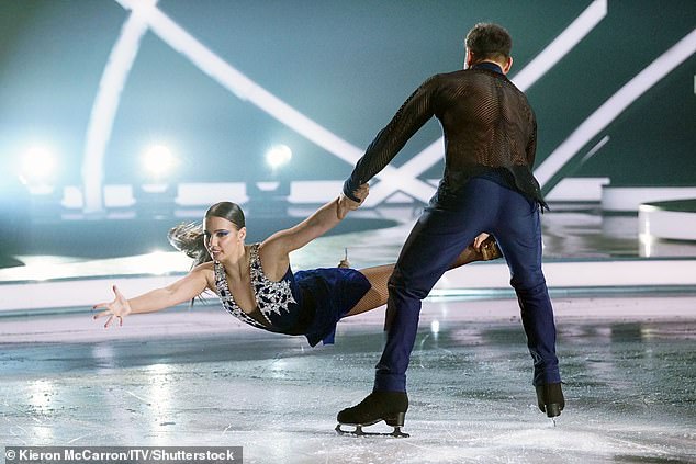 . Back on her feet the pro joined Ryan on the ice as they sent temperature soaring with the routine that even featured rain in the studio