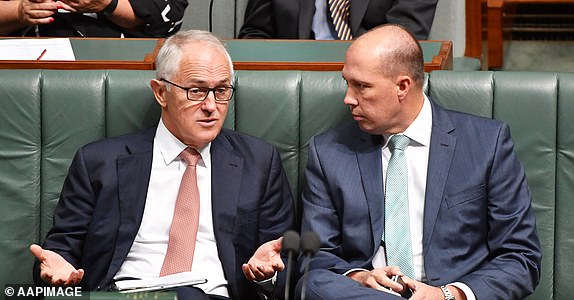 Prime Minister Malcolm Turnbull and Minister for Immigration Peter Dutton during a motion to suspend standing orders moved by Australia's Opposition Leader Bill Shorten in the House of Representatives at Parliament House in Canberra, Monday, Feb. 27, 2017. (AAP Image/Mick Tsikas) NO ARCHIVING