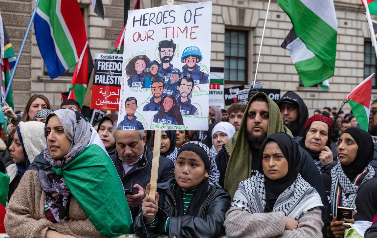 A pro-Palestinian protester holds a handmade placard paying tribute to Palestinian journalists at a rally in Whitehall to call for an immediate ceasefire in Gaza and an end to Israel's occupation on February 3, 2024, in London, United Kingdom.