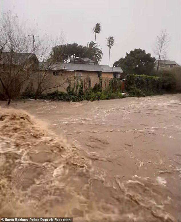 Santa Barbara police department shared a video of brown water exploding out of Mission Creek across West Haley Street and De La Vina Street, turning roads into rivers on Sunday