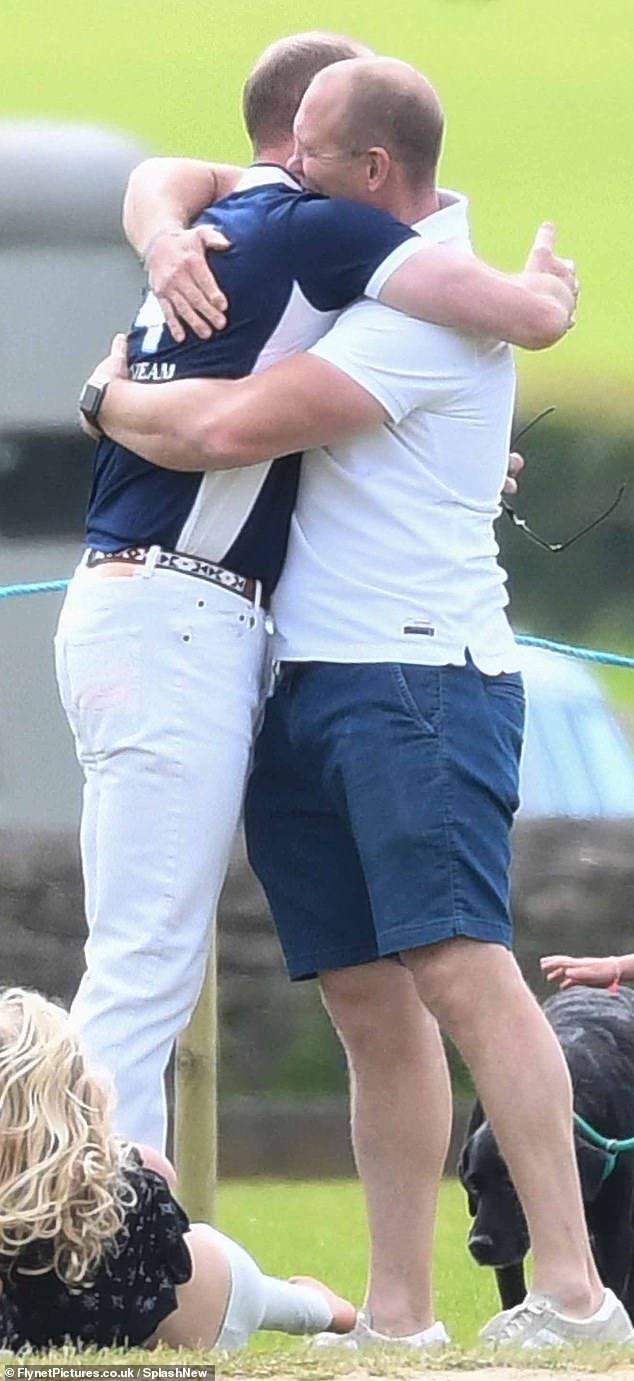 Mike Tindall and Prince William demonstrate their close bond and share a warm hug at a charity polo match in 2017
