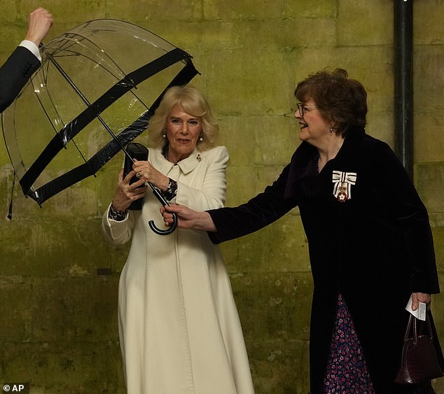 Let me lend a hand: Sarah Troughton (pictured right in Salisbury this week), who is the second cousin of the King, is one of the Queen's 'companions' and provides support to her