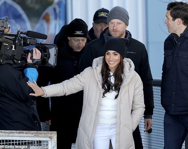A filming crew was spotted joining the Sussexes as they arrived for a day of sit-skiing