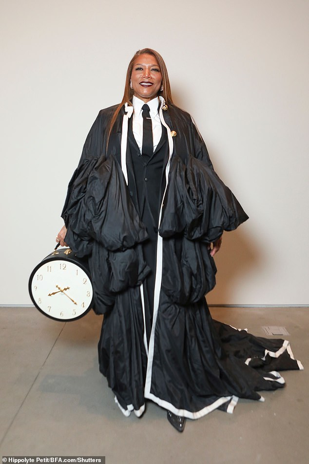Queen Latifah poses solo for the Thom Browne Men's and Women's Fall 2024 Collection