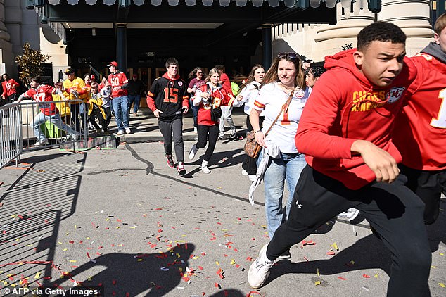 Terrified parade-goers flee for their lives after gunmen opened fire shortly after the Superbowl winners stepped off stage