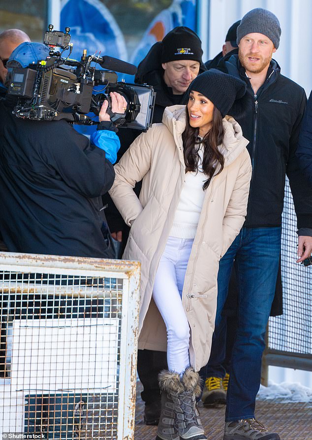 Meghan led the way as she and Harry were filmed as the arrived for the publicity event on Valentine's Day