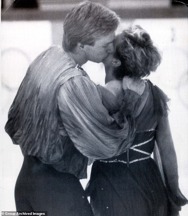 Christopher giving partner Jayne a kiss at the end of a sizzling ice dance performance that won them a gold medal at the Winter Olympics in Sarajevo