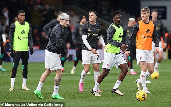 LUTON, ENGLAND - FEBRUARY 18: Alejandro Garnacho, Kobbie Mainoo, Rasmus Hojlund of Manchester United warms up ahead of the Premier League match between Luton Town and Manchester United at Kenilworth Road on February 18, 2024 in Luton, England. (Photo by Matthew Peters/Manchester United via Getty Images)