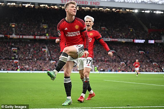 MANCHESTER, ENGLAND - FEBRUARY 04: Rasmus Hojlund of Manchester United celebrates scoring the first goal with team mate Alejandro Garnacho during the Premier League match between Manchester United and West Ham United at Old Trafford on February 04, 2024 in Manchester, England. (Photo by Michael Regan/Getty Images)
