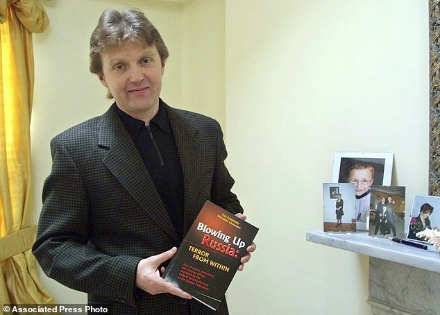 Alexander Litvinenko, former KGB spy and author of the book 'Blowing Up Russia: Terror From Within' is photographed at his home in London, May 10, 2002 - two years before his death