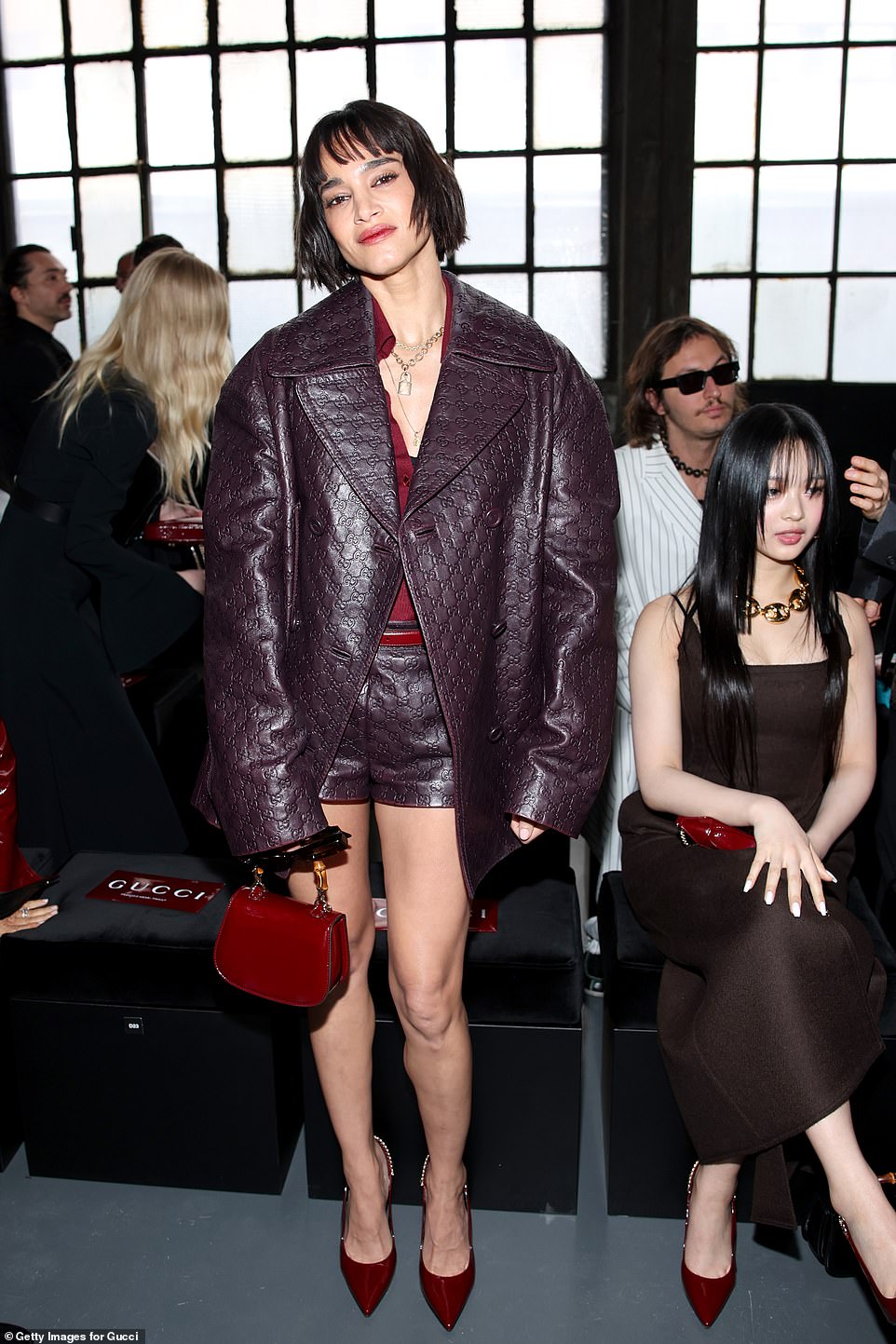 Sofia cut a fashionable appearance in a purple leather blazer jacket and matching shorts