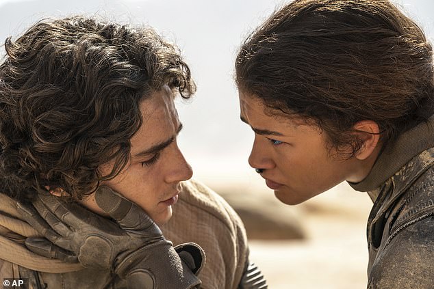 Timothee Chalamet and Zendaya pictured in Dune 2 - with the cast leaning into futuristic ensembles to promote the film