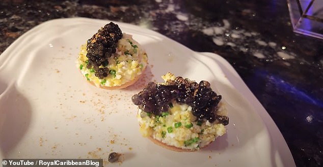 To start, he is served an 'amuse bouche,' which consists of a 'small bagel,' topped with cream cheese and caviar. This is then paired with a glass of Moet champagne