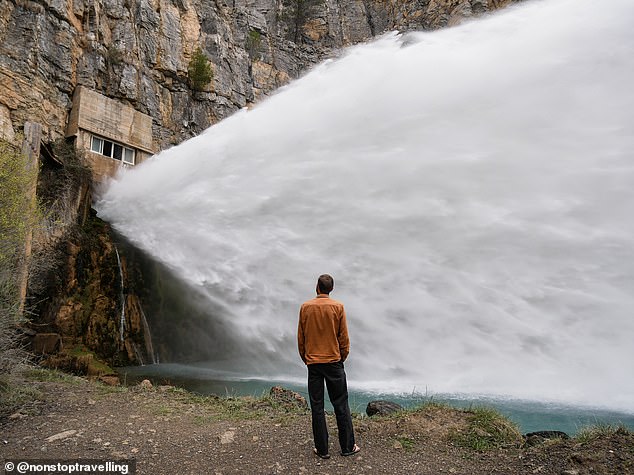 Spain is among the countries to have surprised the couple the most. 'From family beach holidays as a kid, I thought that was all Spain really had to offer,' Lauren said. 'But it¿s such a huge country with varied landscapes and really impressive mountains.' Pictured: Craig at a dam wall in Valencia, Spain