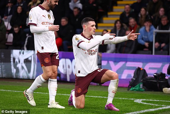 BOURNEMOUTH, ENGLAND - FEBRUARY 24: Phil Foden of Manchester City celebrates scoring the first goal with Bernardo Silva during the Premier League match between AFC Bournemouth and Manchester City at Vitality Stadium on February 24, 2024 in Bournemouth, United Kingdom. (Photo by Marc Atkins/Getty Images)