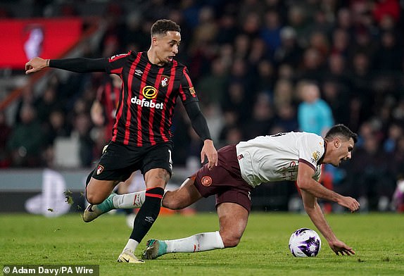 Bournemouth's Marcus Tavernier (left) fouls Manchester City's Rodri during the Premier League match at the Vitality Stadium, Bournemouth. Picture date: Saturday February 24, 2024. PA Photo. See PA story SOCCER Bournemouth. Photo credit should read: Adam Davy/PA Wire.RESTRICTIONS: EDITORIAL USE ONLY No use with unauthorised audio, video, data, fixture lists, club/league logos or "live" services. Online in-match use limited to 120 images, no video emulation. No use in betting, games or single club/league/player publications.