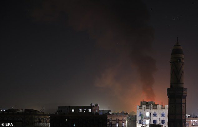 The joint operation targeted weapons storage facilities, drones, air defense systems, radars and a helicopter, and other unmanned surface and underwater vehicles. Pictured: Smoke over Sana'a, Yemen on February 24, 2024