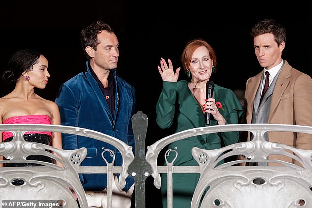 Rowling with the cast of the second 'Fantastic Beasts' film. She reportedly refused to appear in photos with the cast at the premiere of the 2022 sequel
