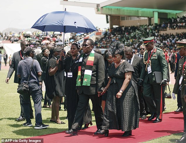 Zimbabwe President Emmerson Mnangagwa pictured arriving, accompanied by his wife Auxillia Mnangagwa (right) at the Independence Stadium in Windhoek yesterday