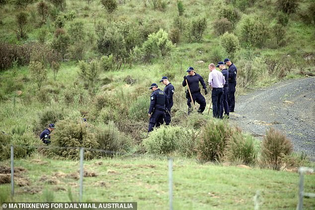 Police were seen searching a number of dams on the remote property (pictured)