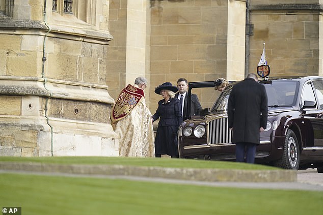 Queen Camilla is greeted as she attends the thanksgiving service at Windsor Castle today