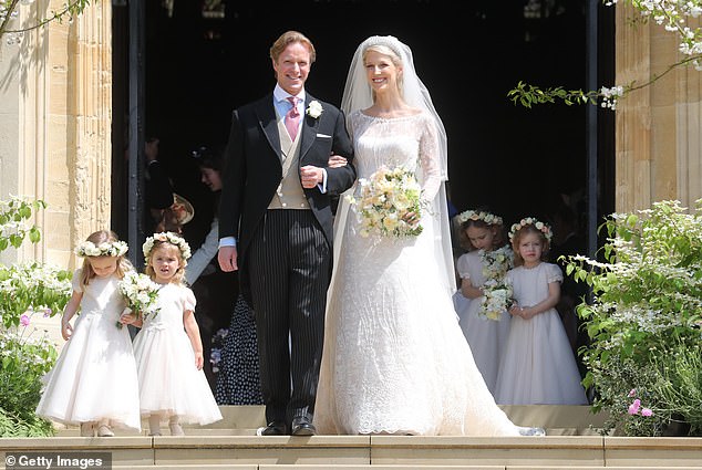 The royal couple looked happier than ever as they exited St George's Chapel following their wedding ceremony