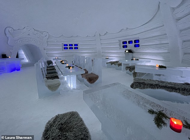 Guests can stay overnight at this ice dome, in beds made from ice. Pictured: The dining hall