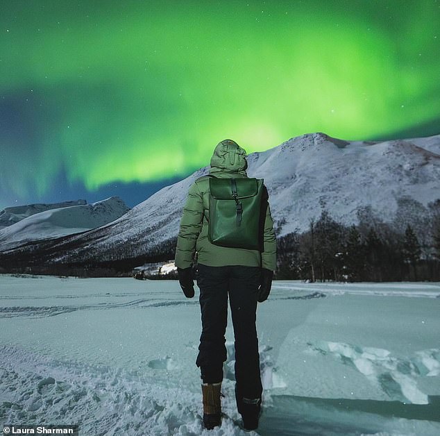 MailOnline Travel's Laura Sharman (above) visits the frozen wilds of Norway, where she dons six layers of clothing to gaze upon the aurora borealis