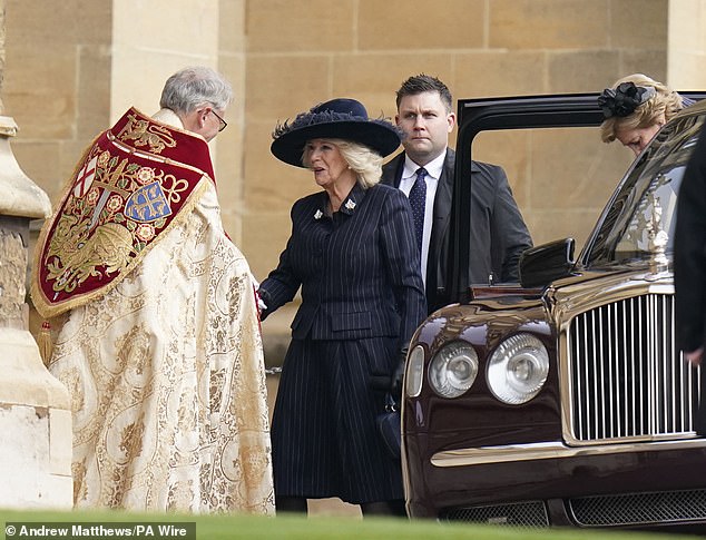 Queen Camilla is greeted as she leads the Royal Family in attending a thanksgiving service for the life of the late King Constantine II at St George's Chapel in Windsor Castle today
