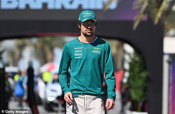 BAHRAIN, BAHRAIN - MARCH 01: Lance Stroll of Canada and Aston Martin F1 Team walks in the Paddock prior to final practice ahead of the F1 Grand Prix of Bahrain at Bahrain International Circuit on March 01, 2024 in Bahrain, Bahrain. (Photo by Rudy Carezzevoli/Getty Images)